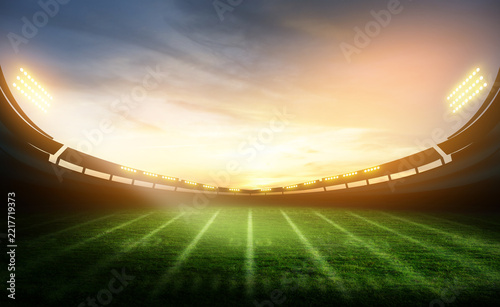 green field in american football stadium