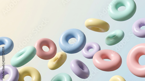 Floating pastel donut shapes on soft gradient background