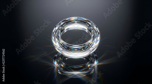 Sparkling clear glass ring with reflection on black background