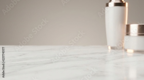 White cosmetic bottles on marble countertop with neutral background
