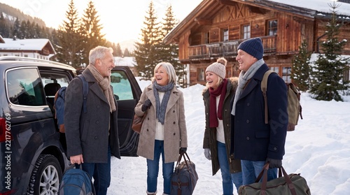 Winter Travel Adventure, A joyful family in winter coats arrives at a snowy holiday retreat, luggage in tow