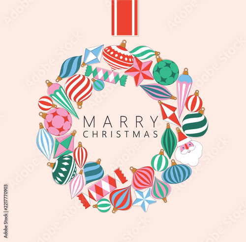 Christmas wreath composed of large shiny glass ornaments toys and decorative baubles drawing on beige background
