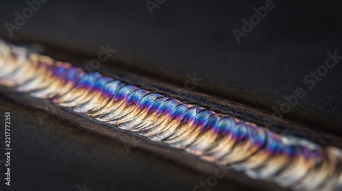 Close Up Macro View Of Colorful TIG Weld Bead On Metal Surface
