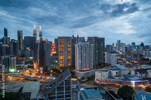 Vibrant Kuala Lumpur skyline at dusk with city lights and modern architecture