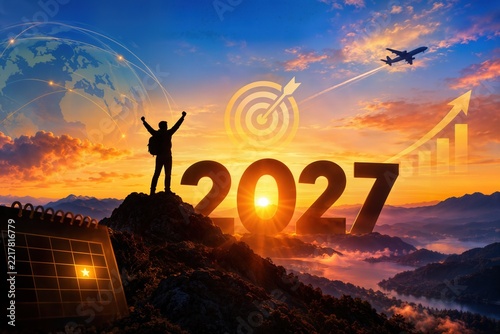 Silhouette of Successful Businessman Standing on Mountain Peak with Arms Raised Celebrating Beside 2027 Text with Target and Growth Chart Icons at Sunrise