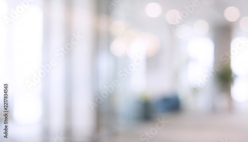 soft blurred background of a modern office interior with bright ambient lighting and a minimalistic design approach, perfect for corporate themes and business concepts.