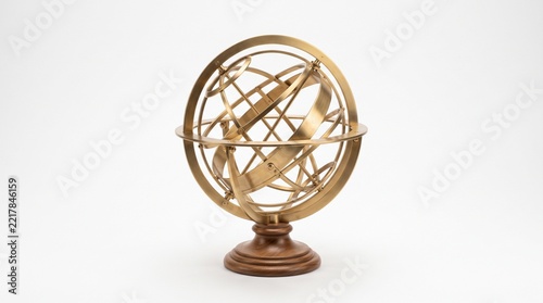 Vintage brass armillary sphere on wooden stand isolated on white background