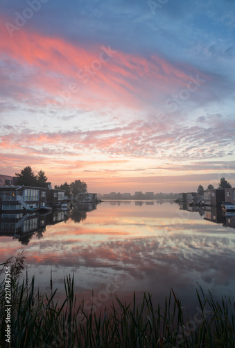 A tranquil, foggy dawn at the lake in Meerstad, Groningen.