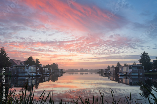 A tranquil, foggy dawn at the lake in Meerstad, Groningen.