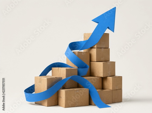 Cardboard boxes on a conveyor belt against a clean background. Logistics and delivery.