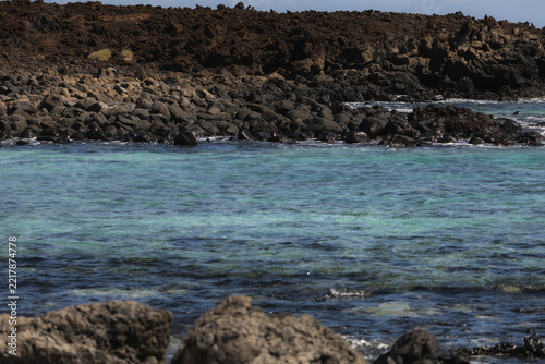 Mojon Blanco Turquoise Lagoon and Rugged Lava Cliffs