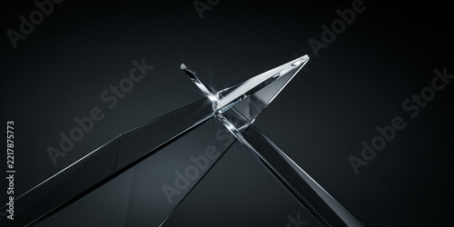 Macro shot of a sharp glass edge intersecting on a dark background