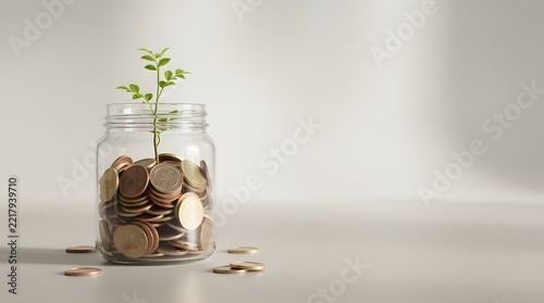 Small plant growing from jar of coins symbolizing financial growth