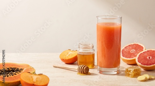 Fresh Fruit Smoothie in Glass with Papaya Grapefruit Persimmon Honey and Ginger