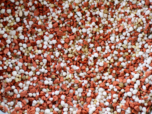 Close up of mixed chemical fertilizer granules (15-5-25) for agriculture background 