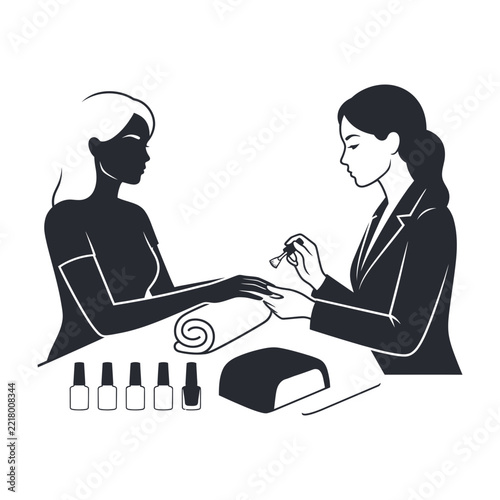 Nail technician giving woman manicure at salon