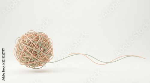 Ball of Natural Twine with Unwinding Thread on White Ground