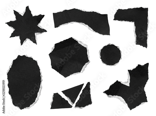 Collection of torn black paper shapes with jagged edges on white isolated background