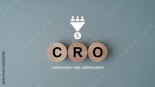 CRO concept represented by wooden letters and funnel icon symbolizing conversion rate optimization for business growth