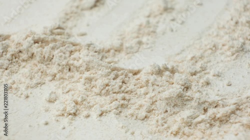 Rotating organic spelt wheat flour powder texture top view