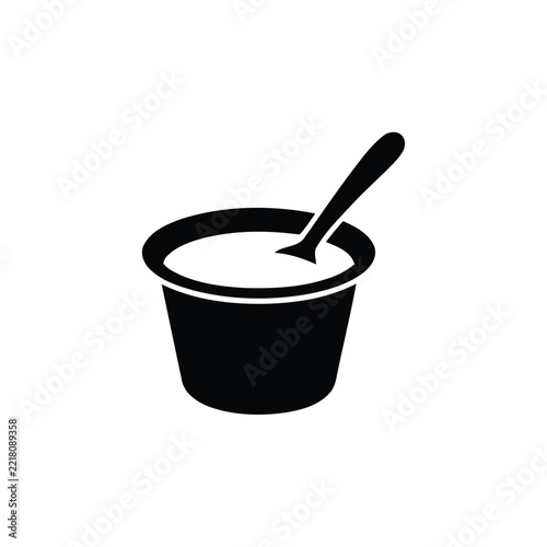 Minimalist paint bucket icon, black silhouetted container with dip brush, vector symbol for design projects