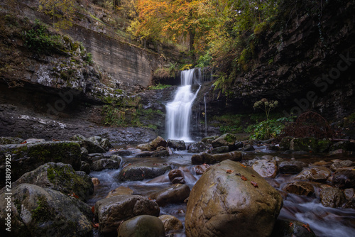 Fotografie Scenic landscape in deciduous forest and waterfall in Sierra Cebollera in La Rio