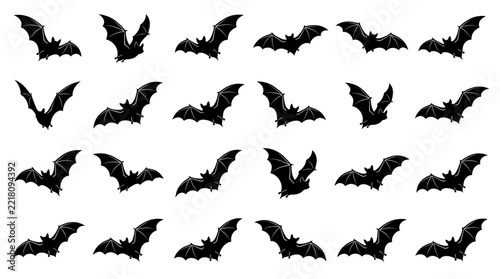 Set of flying bat silhouettes in various poses on white background