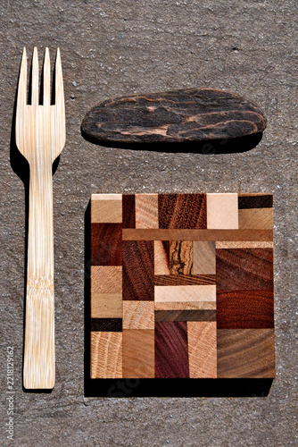 Wood vignette. Driftwood, A Coaster made of different types of wood and a wooden fork