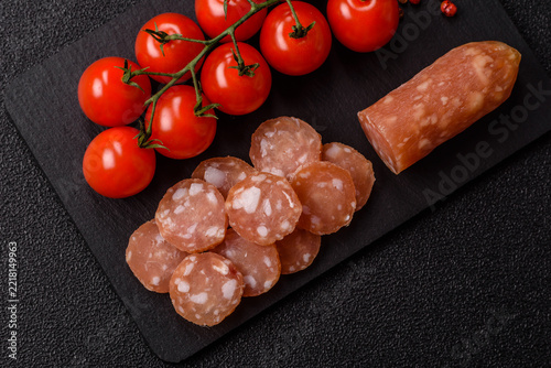 Sliced dry cured chicken sausage or smoked meat with salt and spices. Sliced smoked chicken sausage