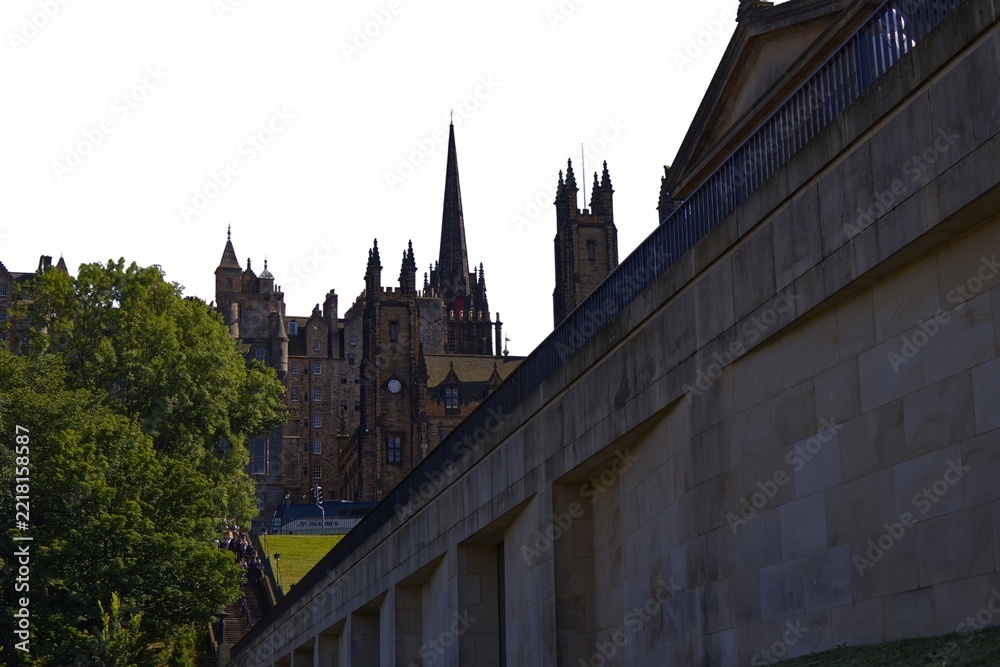 Obraz premium Historic Edinburgh buildings and stone wall isolated on a white background
