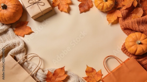 Autumn sale background with pumpkins gift box and shopping bags on
