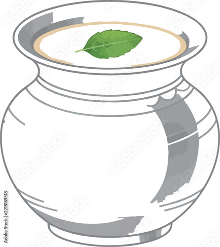 Refreshing traditional Indian lassi drink served in a classic clay pot garnished with a fresh mint leaf