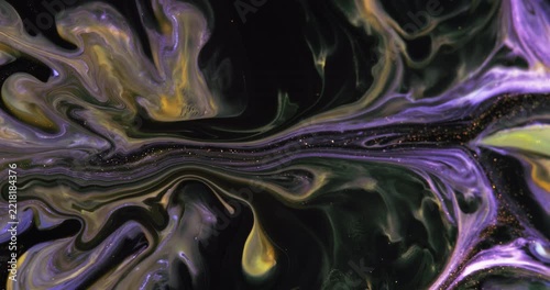 Abstract art of painting. Free flow of blue and yellow paint on a black background. Fluid art painting, abstract acrylic texture.