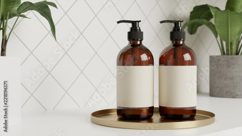 Two amber pump bottles with labels on the tray for liquids