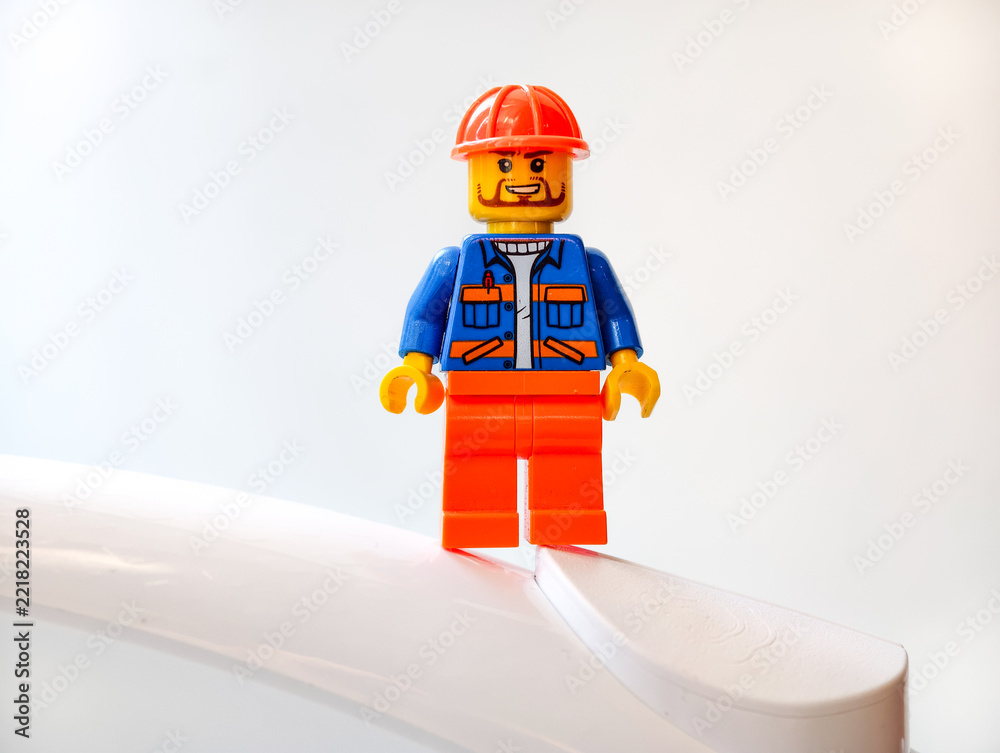Naklejka premium Russia, St. Petersburg, August 8, 2020 Lego figure standing on top of a white surface