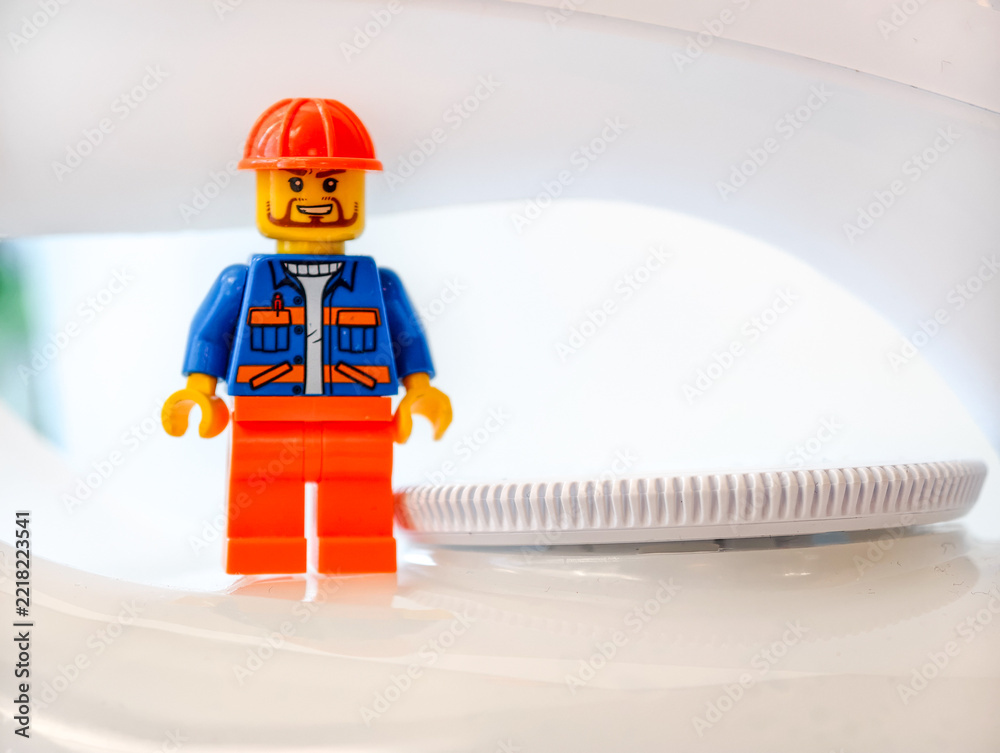Naklejka premium Russia, St. Petersburg, August 8, 2020 A single Lego man figure standing on the top of a microwave