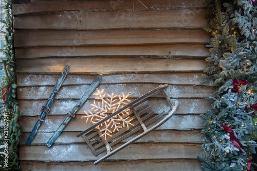 Canvas Print illuminated churros sign with vintage skis, wooden sled and Christmas decorations near Columbia Road Flower Market