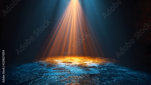 Dramatic golden spotlight projecting light beams onto a dark wet asphalt ground with glowing blue ambient neon lighting