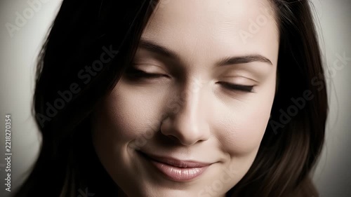 Close up portrait of a young woman with sparkling makeup and brown hair
