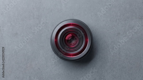 Modern Camera Lens with Red Accents on Concrete Background.
