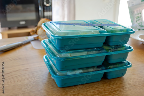 Meal Prep Easy Chicken Alfredo: stack of three lidded meal prep containers ready for refrigerator or freezer storage.