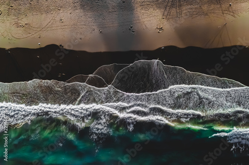 Emerald Breakers Over Dark Sands