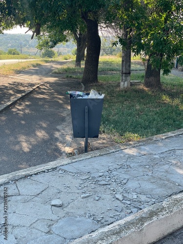 Overflowing Public Metal Trash Can Full Of Plastic Bottles Waste Outdoor Park