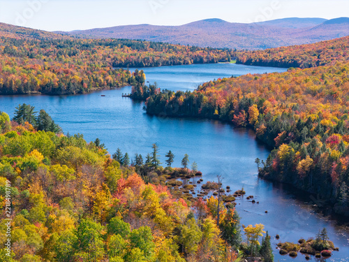 aerial view of lake in autumn forest in white mountain
