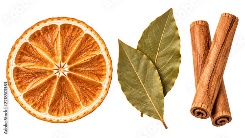 Dried orange wheel, bay leaves and cinnamon sticks isolated on transparent background, Christmas aromatic spice set.