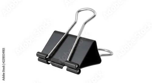 Single black metal binder clip with silver wire handles, isolated on a solid black background