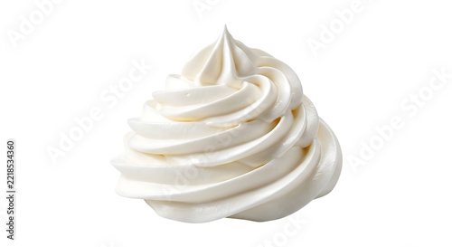Swirled dollop of white whipped cream isolated on a solid black background dairy