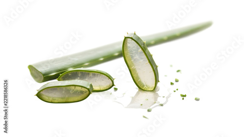 Green pill capsules with powder on white surface