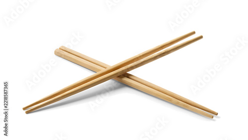 Two wooden chopsticks crossing in air