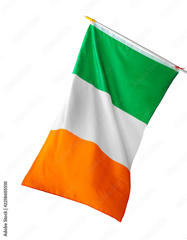 Fototapeta premium Irish flag waving in the wind during a public event in a city square in Ireland